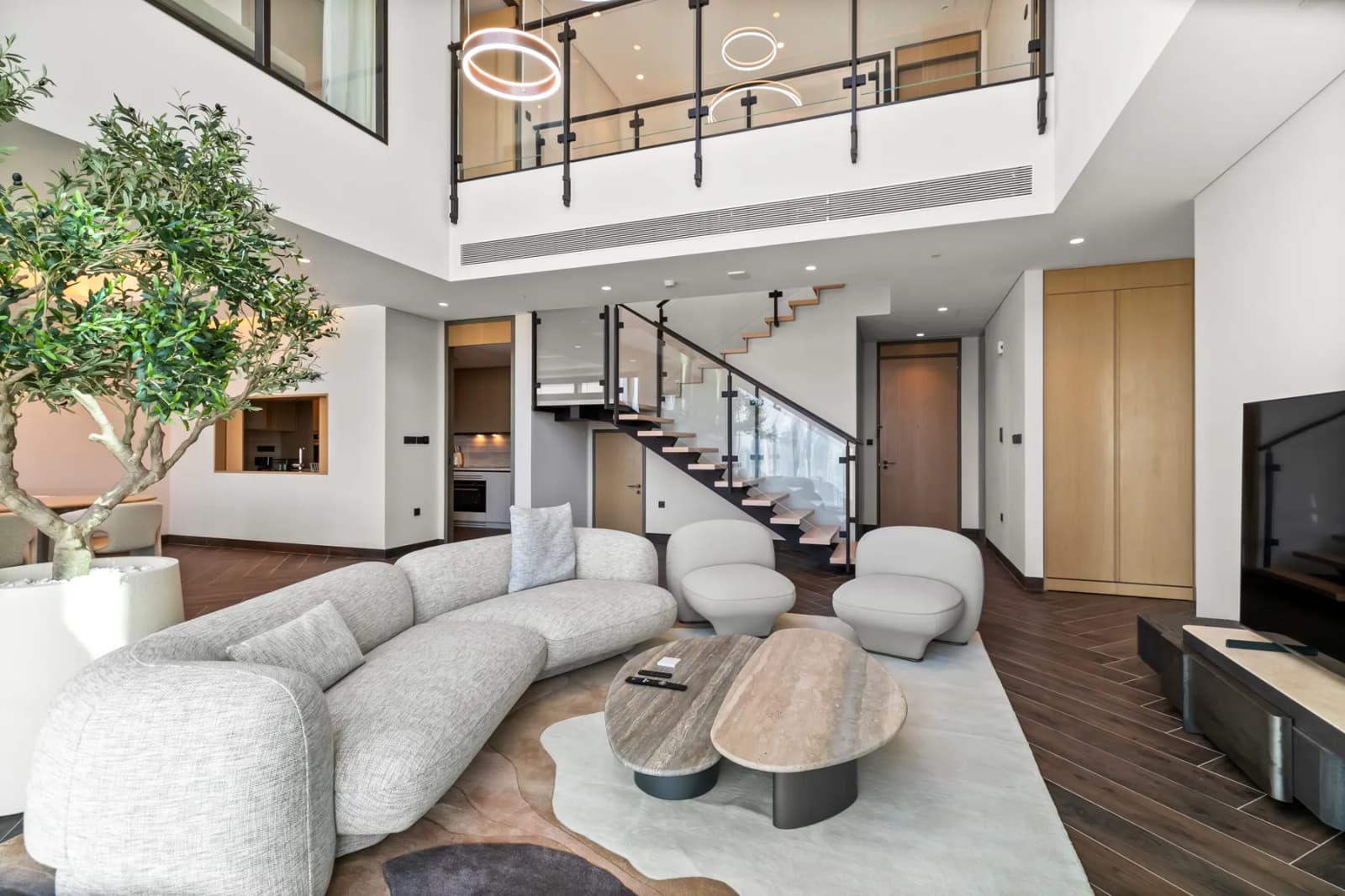 A furnished two-storey living room in a Keys Please managed apartment in Dubai