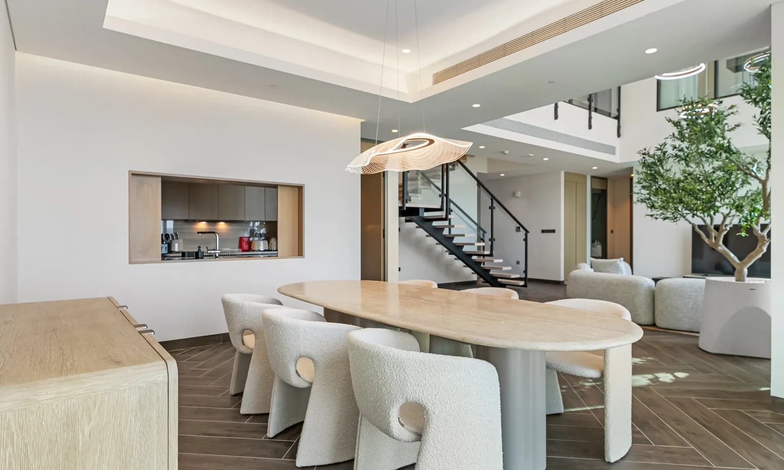A dining area and open kitchen in a home managed by Keys Please